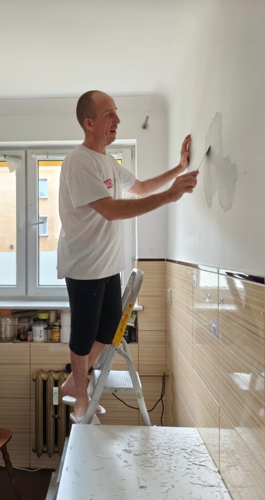 07072026_1310 Tomasz Siniak (FILE TO PRINT) at mothers apartment private renovation in Zielona Gora city of Poland. Between 7th and 19th July 2026 Tomasz performed by hisself third since February 2020 mother's apartment renovation including the plastering, spackling, painting of walls, ceilings, doors, and other tasks on all apartment. He's already back in Warsaw/Zabki. You privately or in company need some similar service? He can help you also. Photo made by his mother, copyright by Tomasz Siniak (FILE TO PRINT).